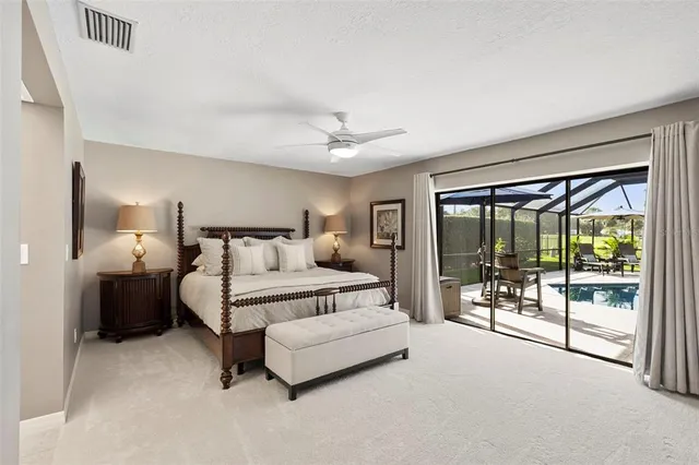 a kitchen with stainless steel appliances granite countertop a stove top oven a sink a dining table and chairs