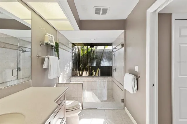 a kitchen with sink and refrigerator