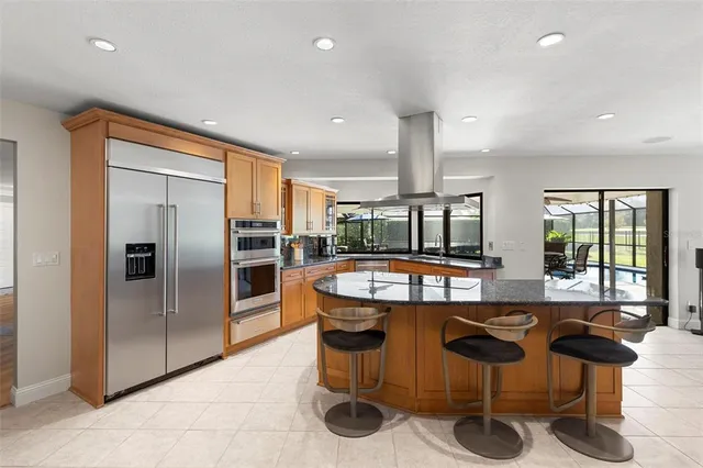 a living room with furniture a window and a flat screen tv