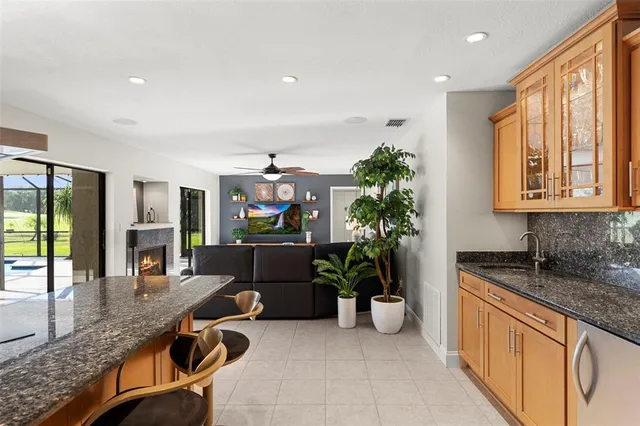a view of a dining room with furniture wooden floor and chandelier