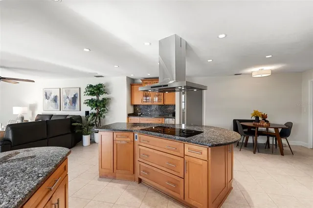 a living room with furniture a rug and a flat screen tv