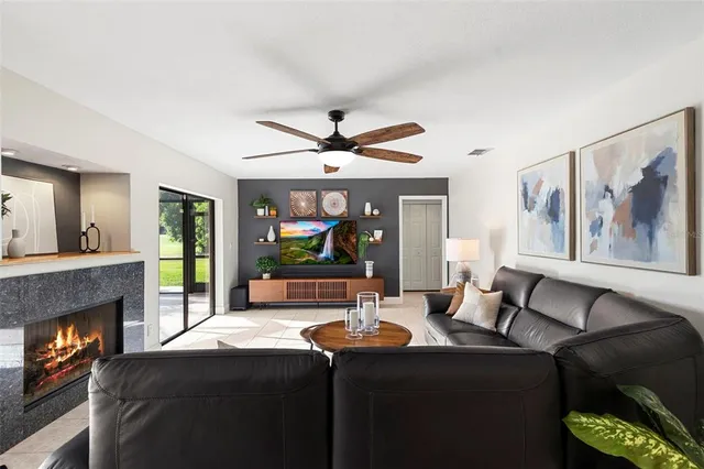 an aerial view of residential houses with outdoor space and trees