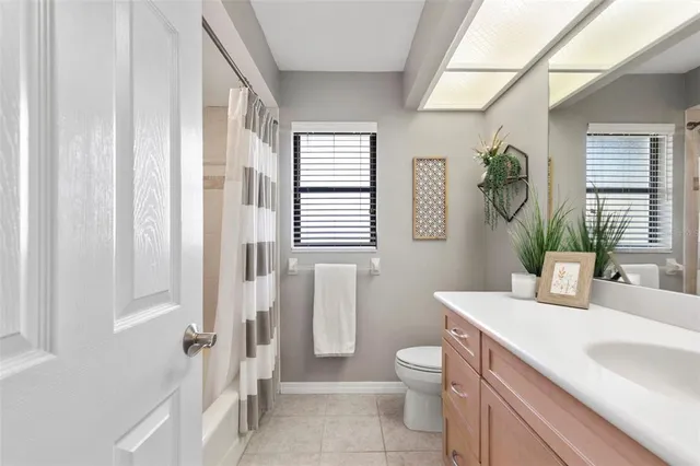 a front view of house with yard and garage