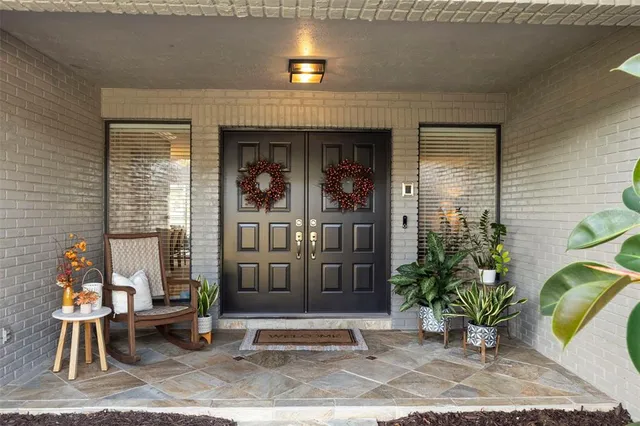 a view of a kitchen with a sink and a refrigerator