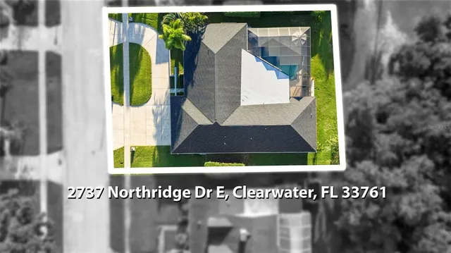 a living room with furniture and a lamp