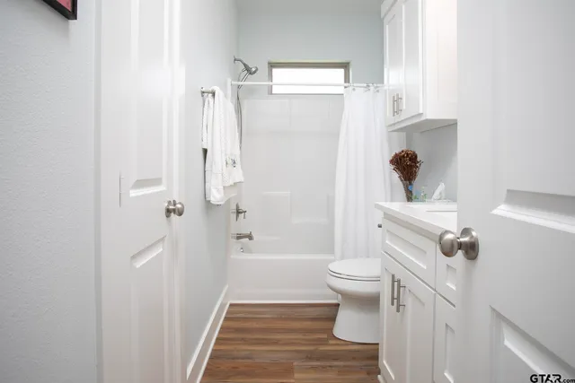 a bathroom with a sink and toilet