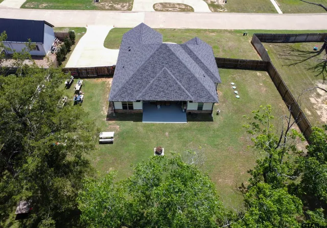 a aerial view of a house with a yard