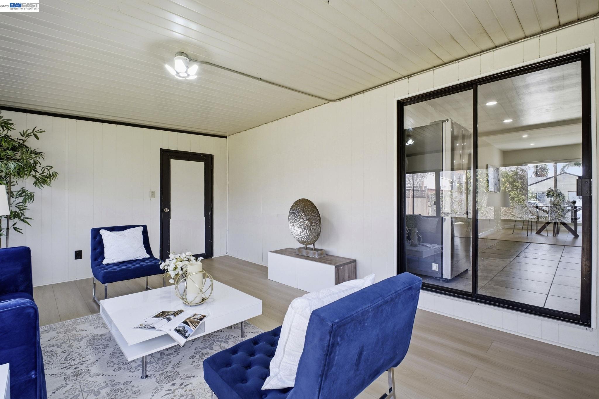 937 Neil Way Hayward, CA 94545 - Photo 11 of 37 a living room with furniture and wooden floor