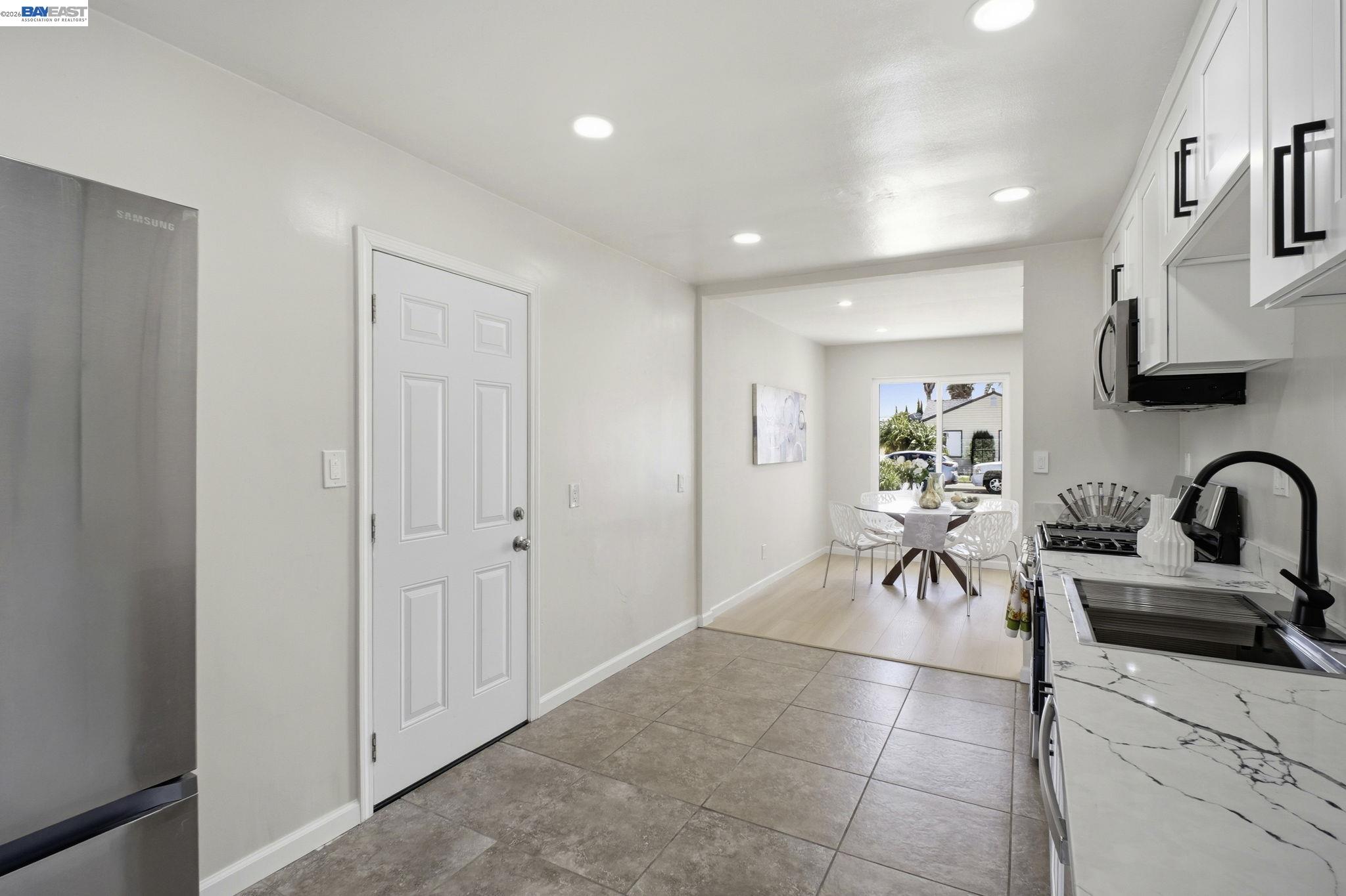 937 Neil Way Hayward, CA 94545 - Photo 16 of 37 a view of a livingroom with a dinning area a sink and a couch