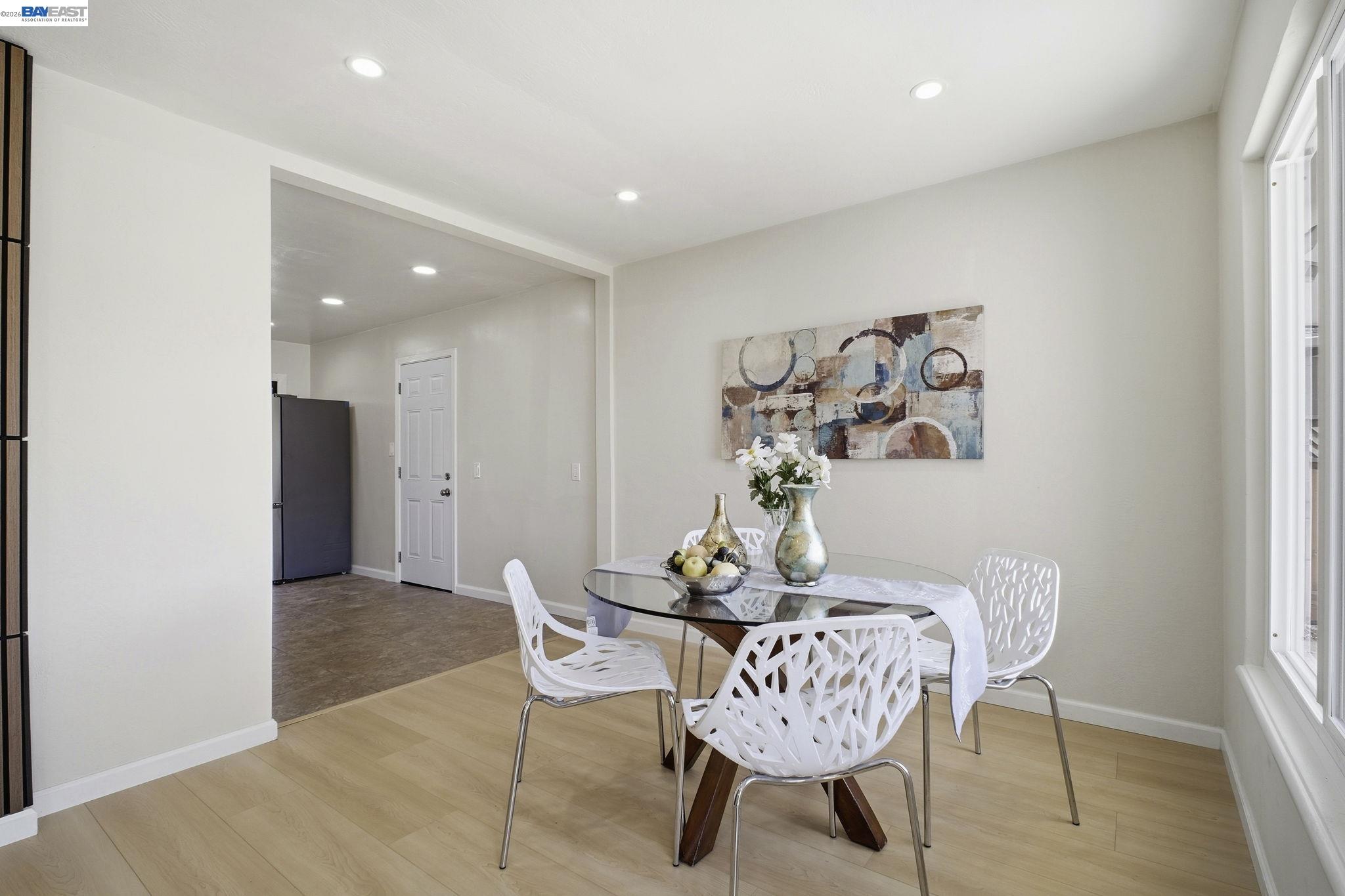 937 Neil Way Hayward, CA 94545 - Photo 17 of 37 a dining room with furniture and wooden floor