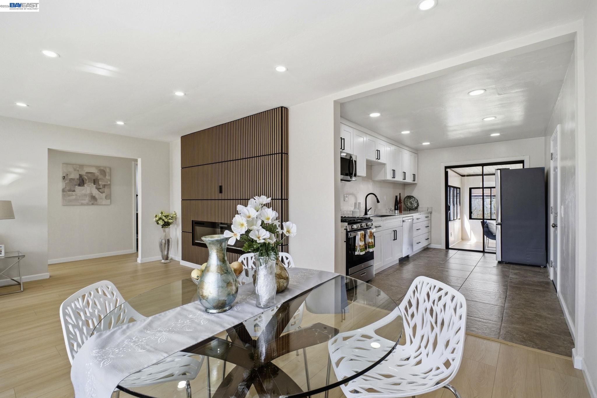 937 Neil Way Hayward, CA 94545 - Photo 19 of 37 a living room with furniture and a dining table