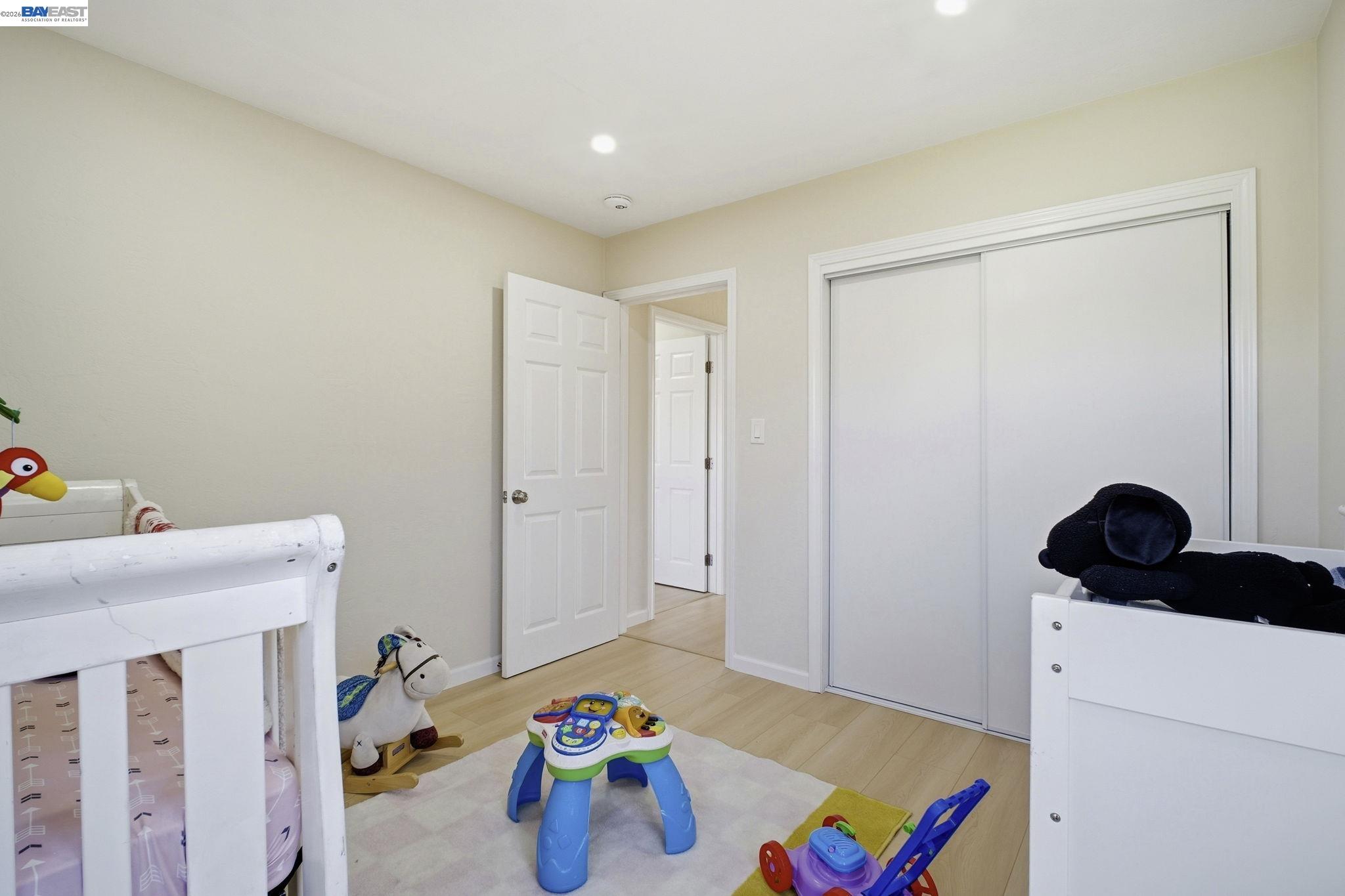 937 Neil Way Hayward, CA 94545 - Photo 21 of 37 a bedroom with a bed and a window