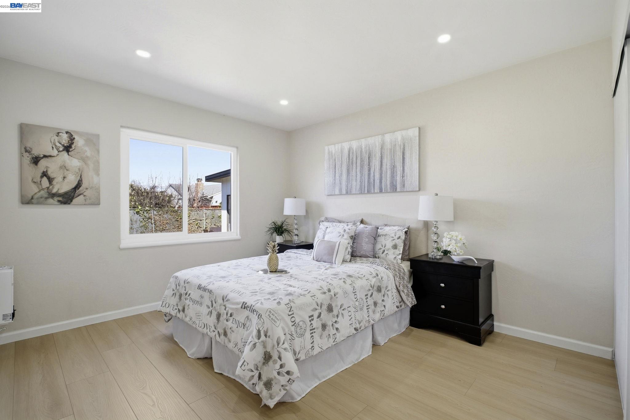 937 Neil Way Hayward, CA 94545 - Photo 22 of 37 a bedroom with a bed and a window