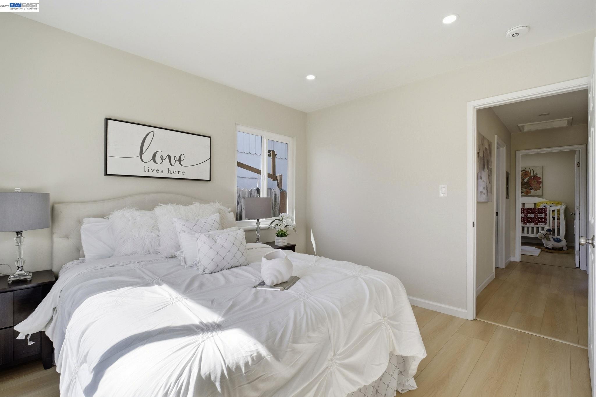 937 Neil Way Hayward, CA 94545 - Photo 27 of 37 a bedroom with a bed and a painting on the wall