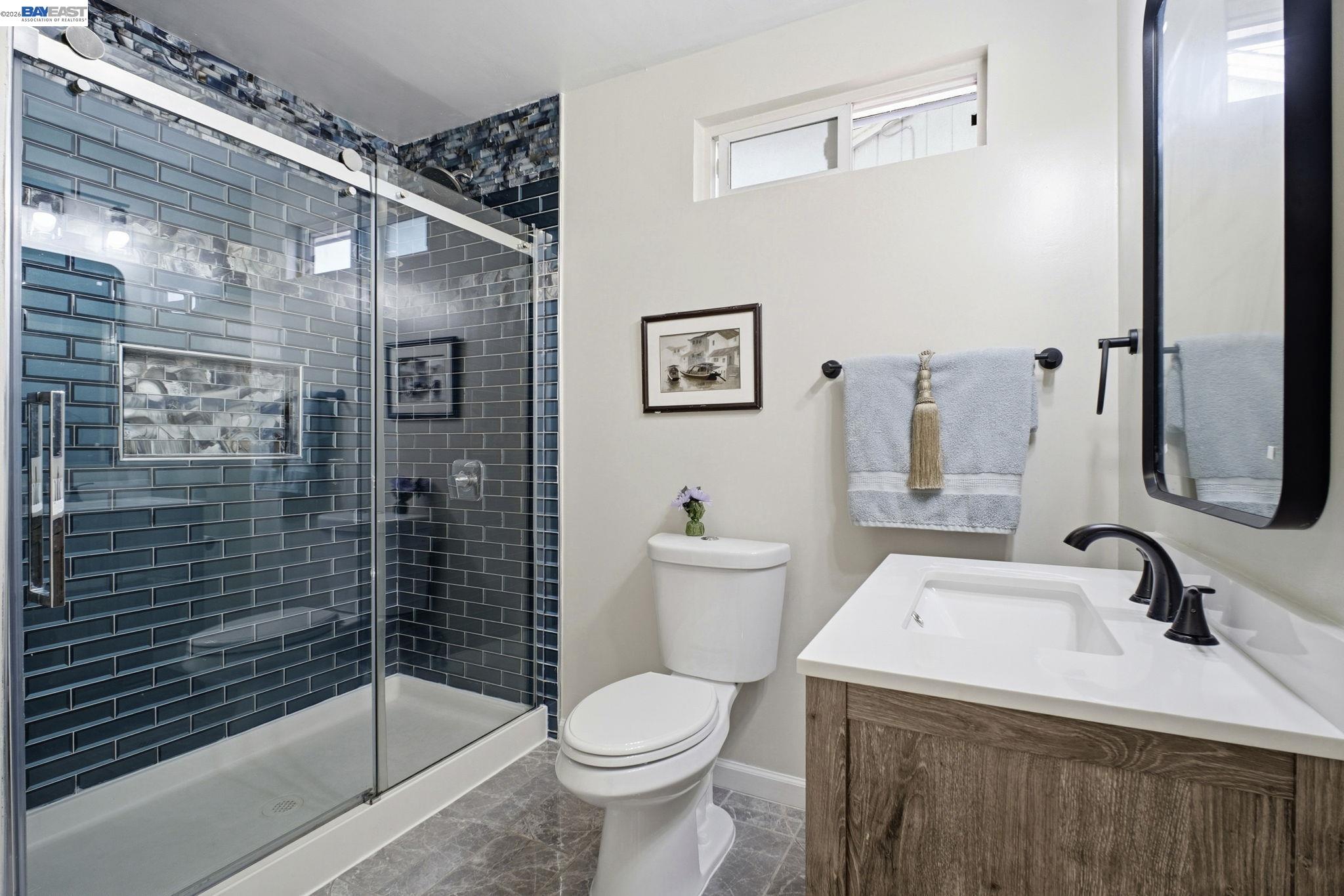 937 Neil Way Hayward, CA 94545 - Photo 29 of 37 a bathroom with a sink toilet and shower