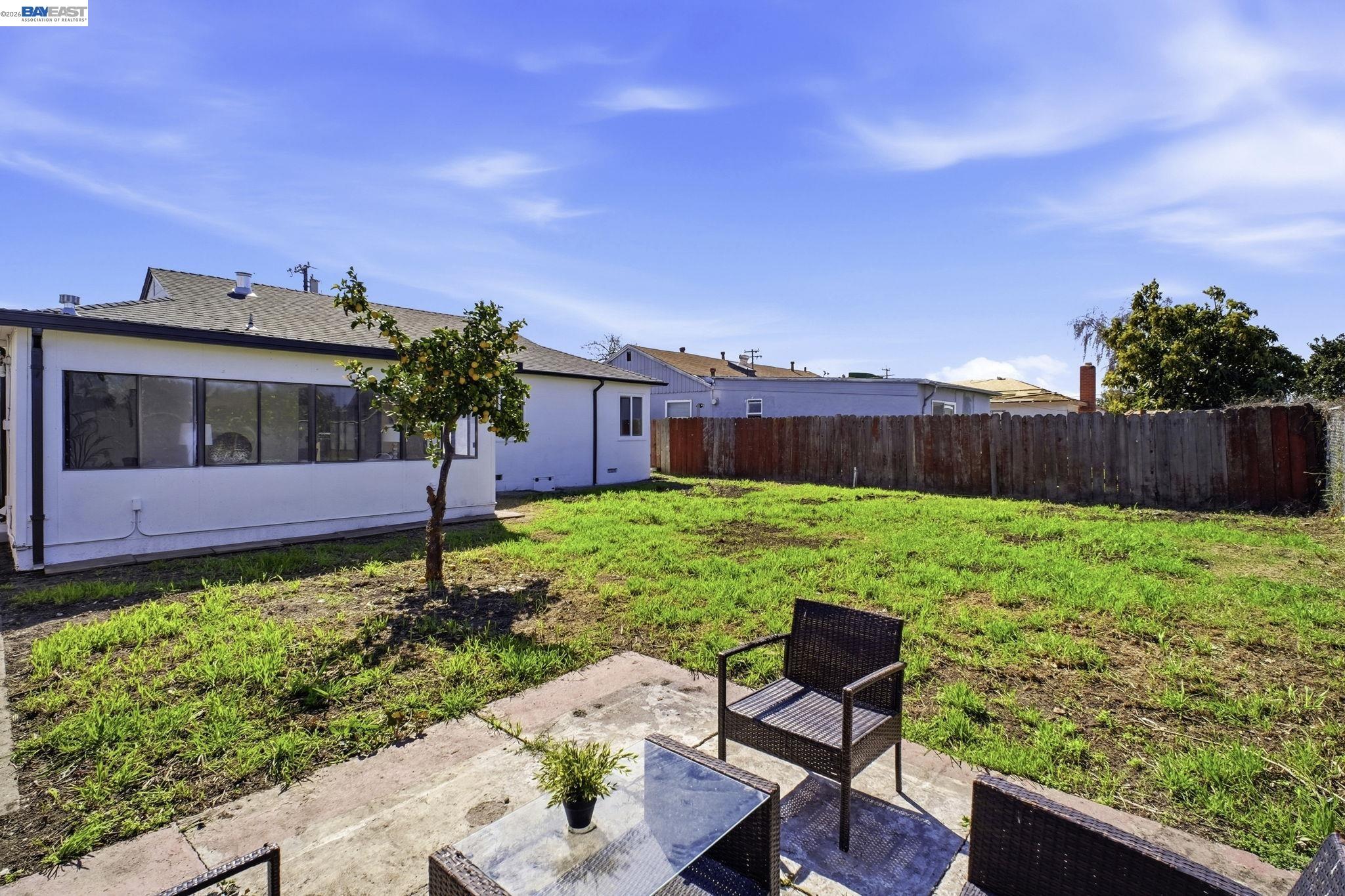 937 Neil Way Hayward, CA 94545 - Photo 33 of 37 a backyard of a house with table and chairs