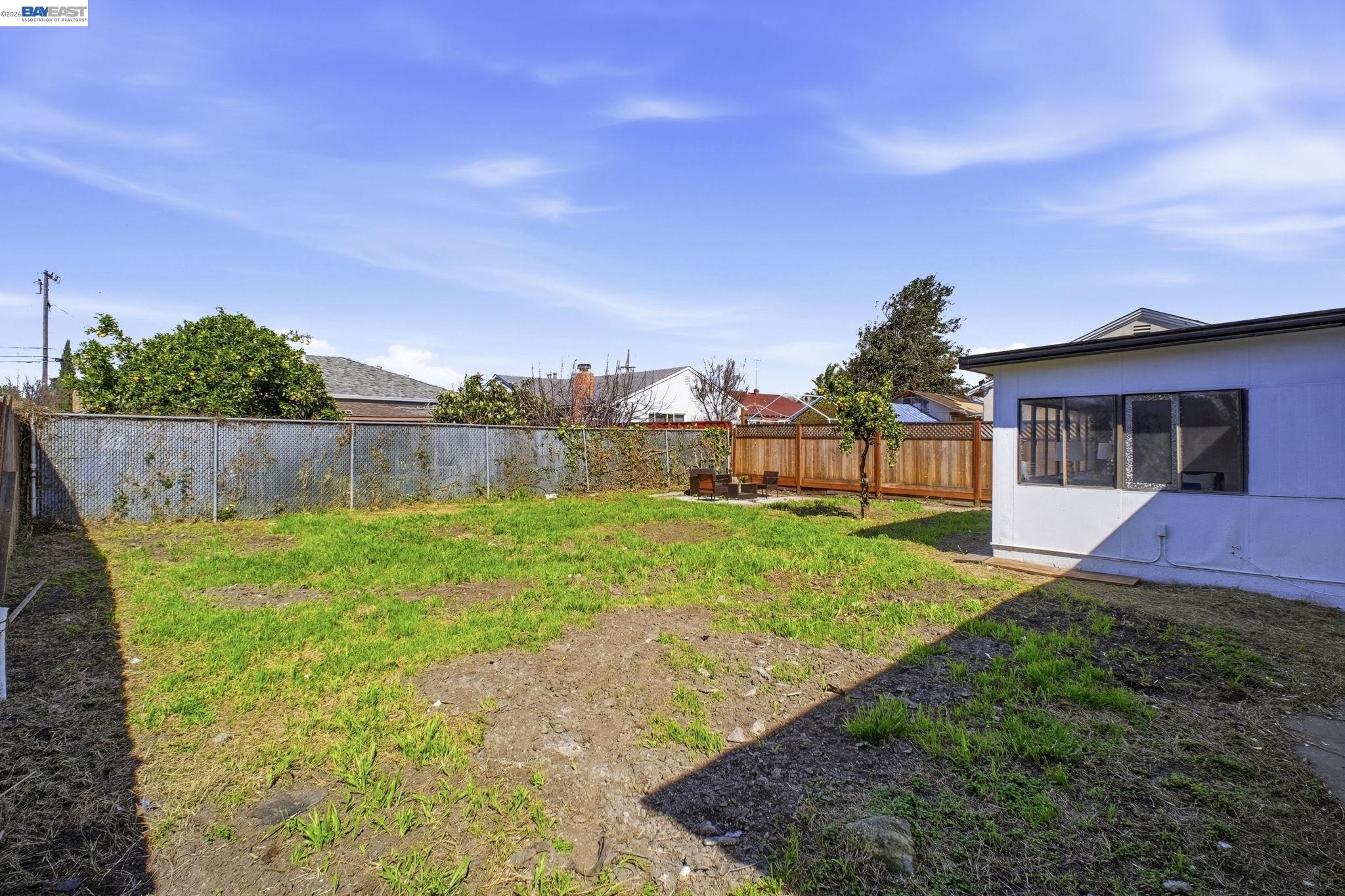 937 Neil Way Hayward, CA 94545 - Photo 36 of 37 a view of a house with backyard and a sitting area