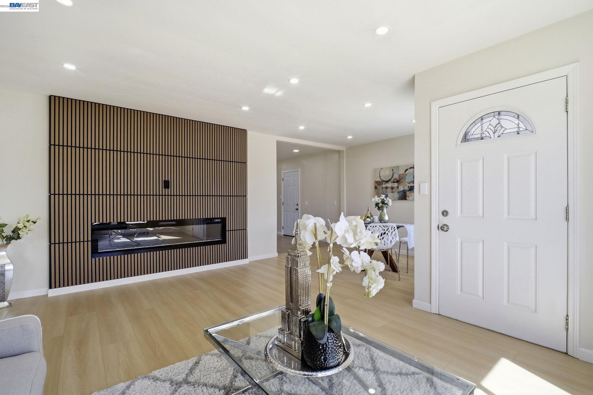 937 Neil Way Hayward, CA 94545 - Photo 5 of 37 a living room with furniture potted plant and kitchen view