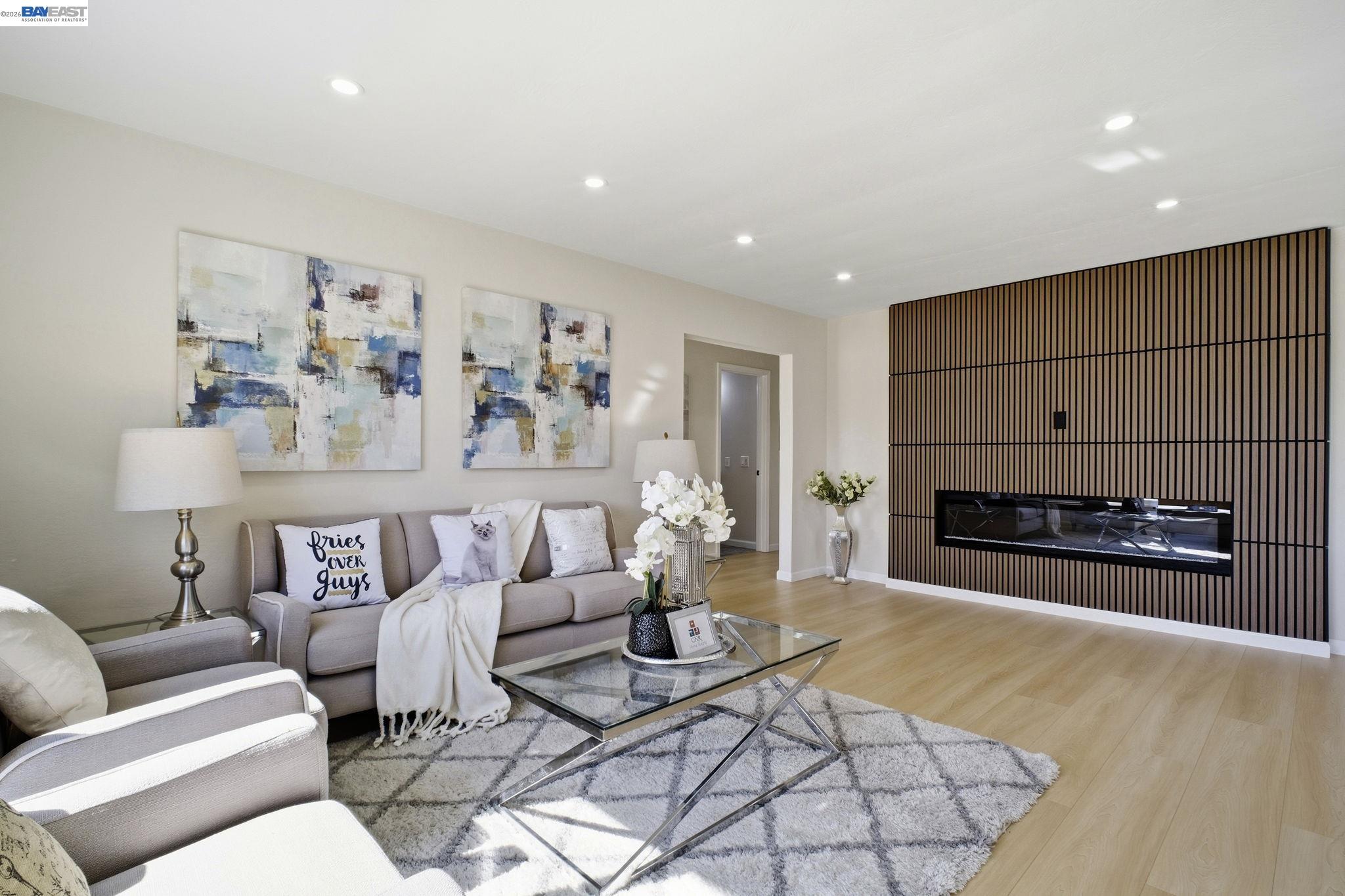 937 Neil Way Hayward, CA 94545 - Photo 6 of 37 a living room with furniture a fireplace and a flat screen tv