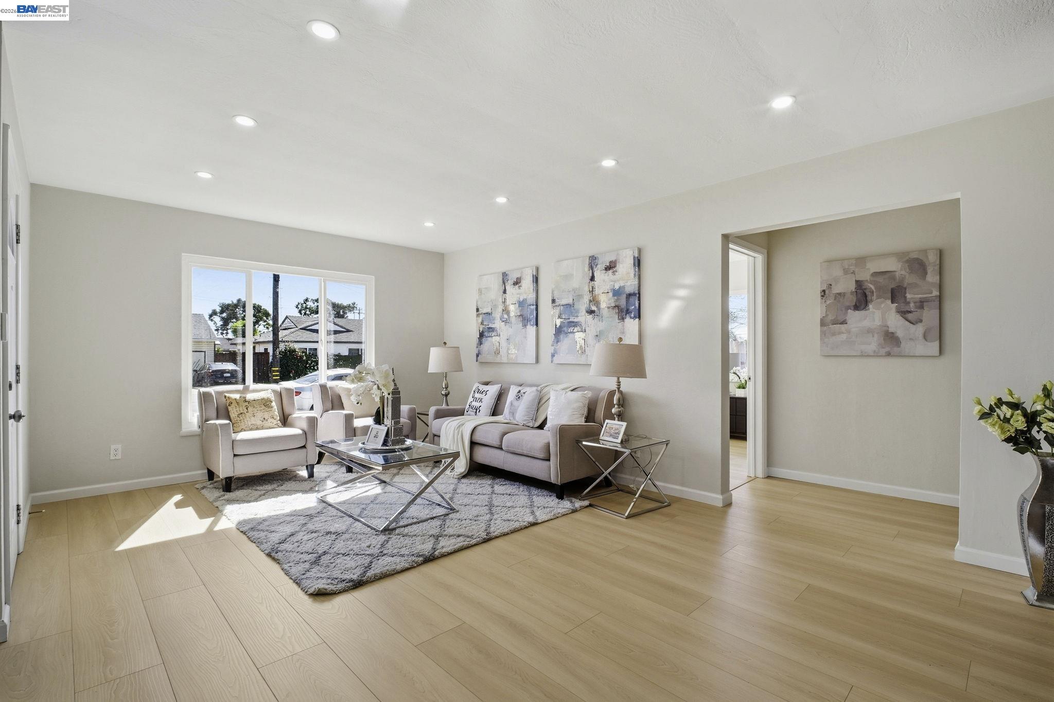 937 Neil Way Hayward, CA 94545 - Photo 7 of 37 a living room with furniture large window and wooden floor