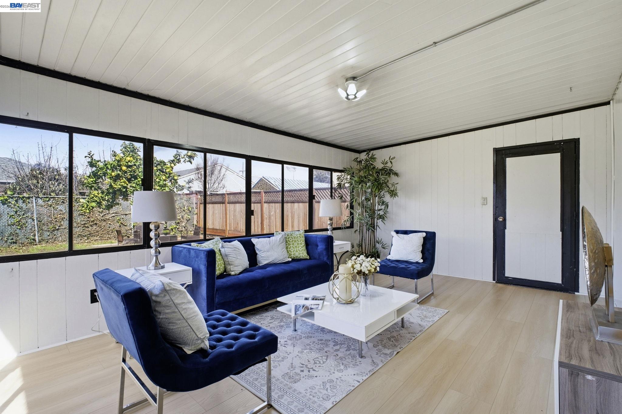 937 Neil Way Hayward, CA 94545 - Photo 9 of 37 a living room with furniture and a large window