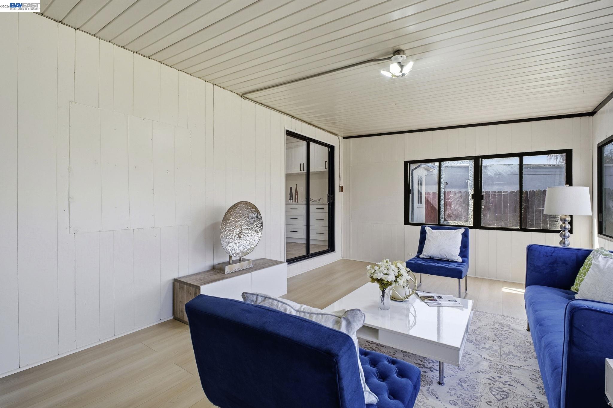 937 Neil Way Hayward, CA 94545 - Photo 10 of 37 a living room with furniture and a large window