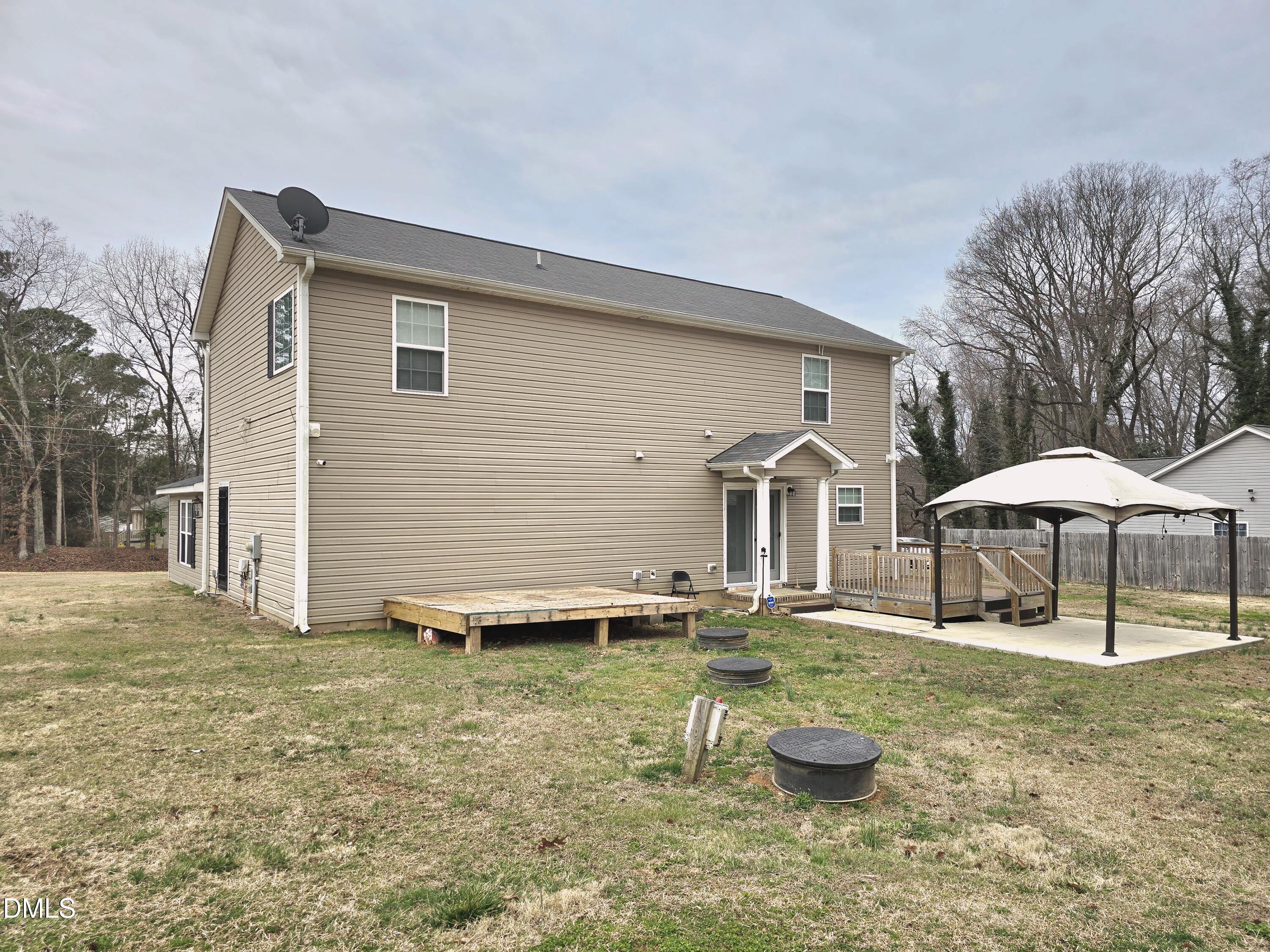 202 Mason Road Durham, NC 27712 - Photo 14 of 15 a backyard of a house with table and chairs