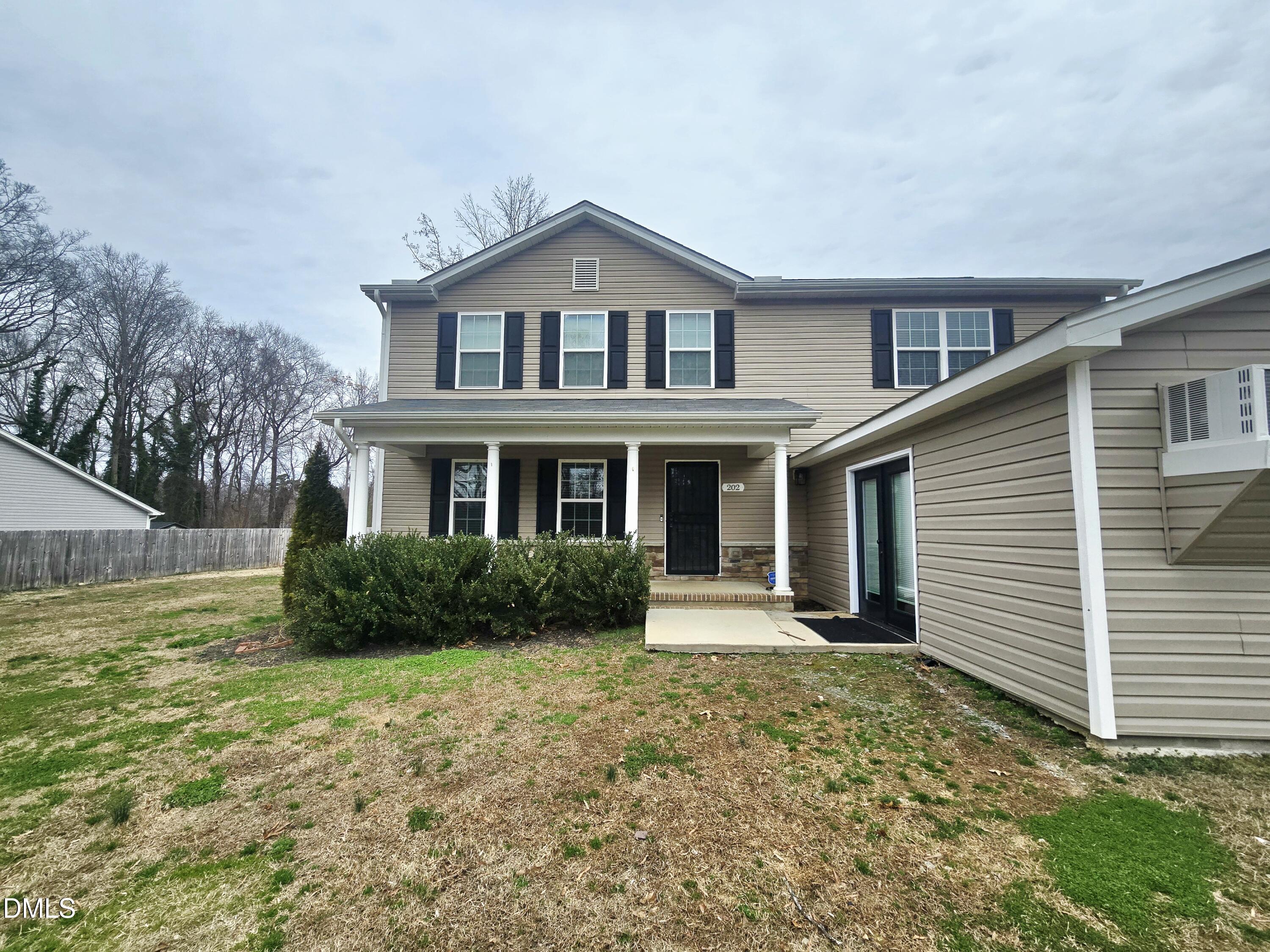 202 Mason Road Durham, NC 27712 - Photo 2 of 15 a front view of a house with garden
