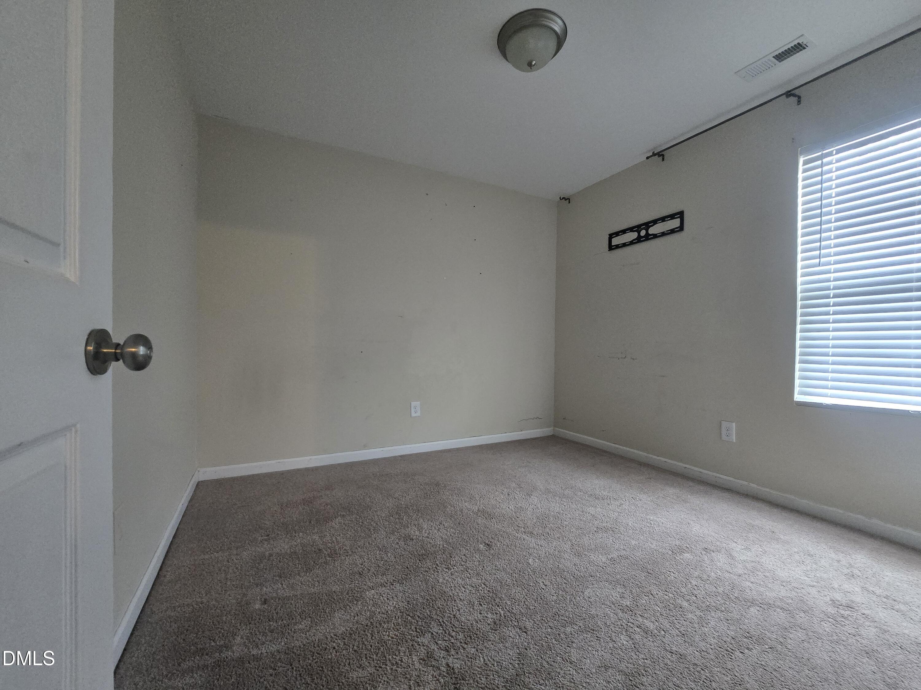 202 Mason Road Durham, NC 27712 - Photo 10 of 15 an empty room with a workbench
