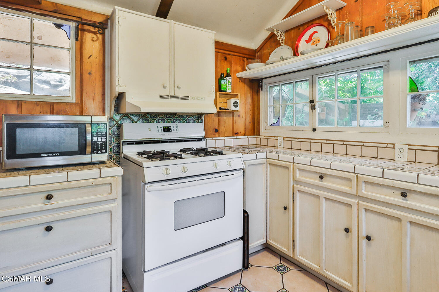 6456 Clear Springs Road Simi Valley, CA 93063 - Photo 18 of 56 a kitchen with white cabinets and a stove with wooden floor