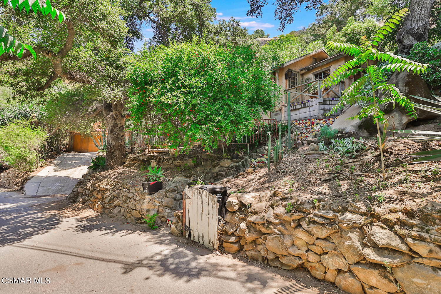 6456 Clear Springs Road Simi Valley, CA 93063 - Photo 2 of 56 a view of a yard with plants and large trees