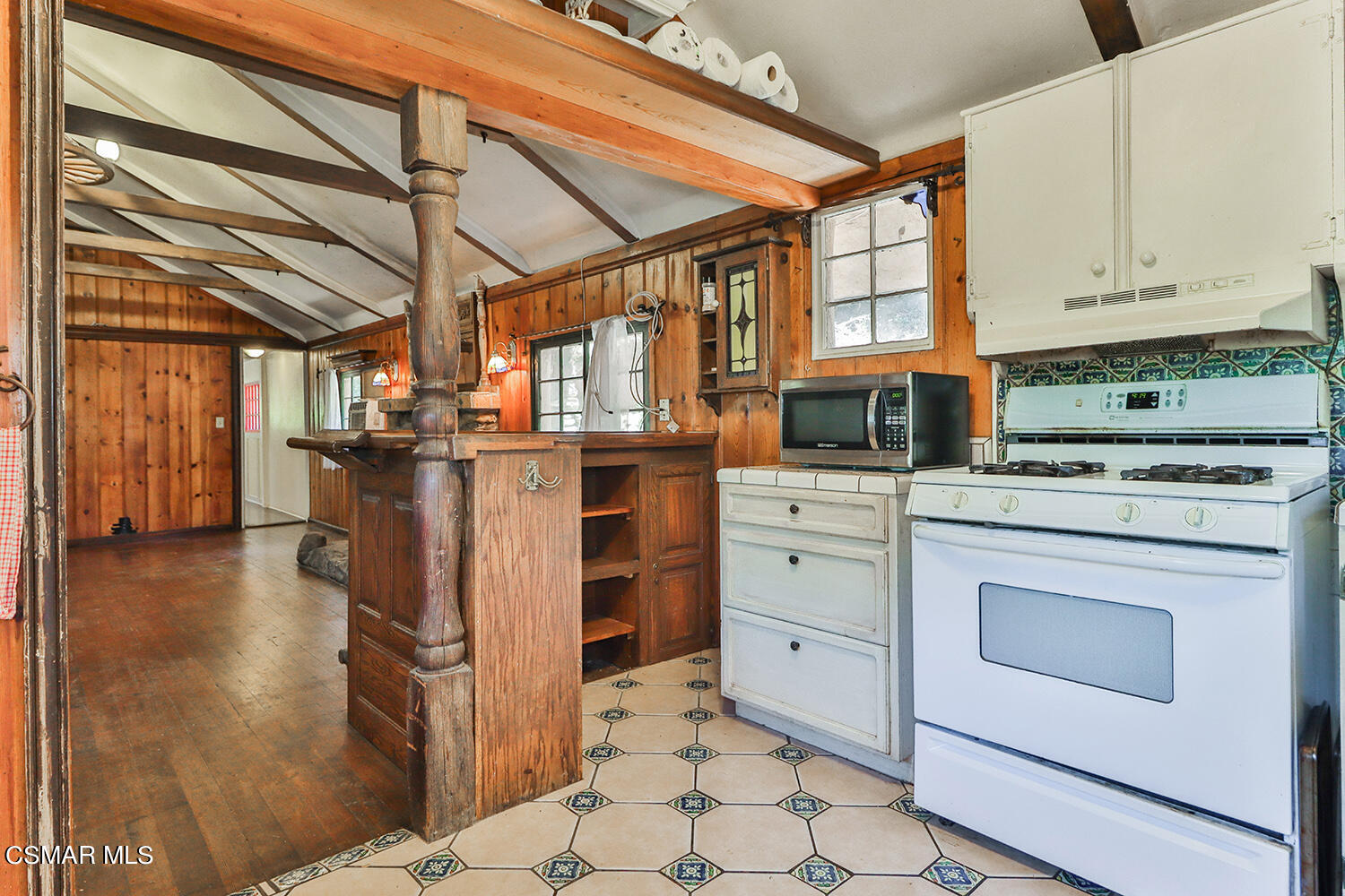 6456 Clear Springs Road Simi Valley, CA 93063 - Photo 21 of 56 a kitchen with appliances cabinets and a table
