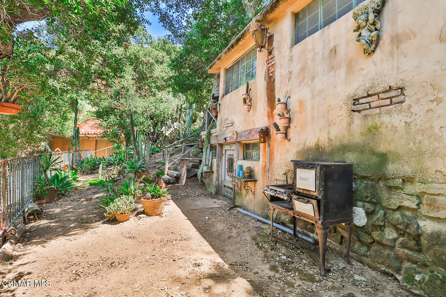 6456 Clear Springs Road Simi Valley, CA 93063 - Photo 39 of 56 a wooden bench sitting in front of a building