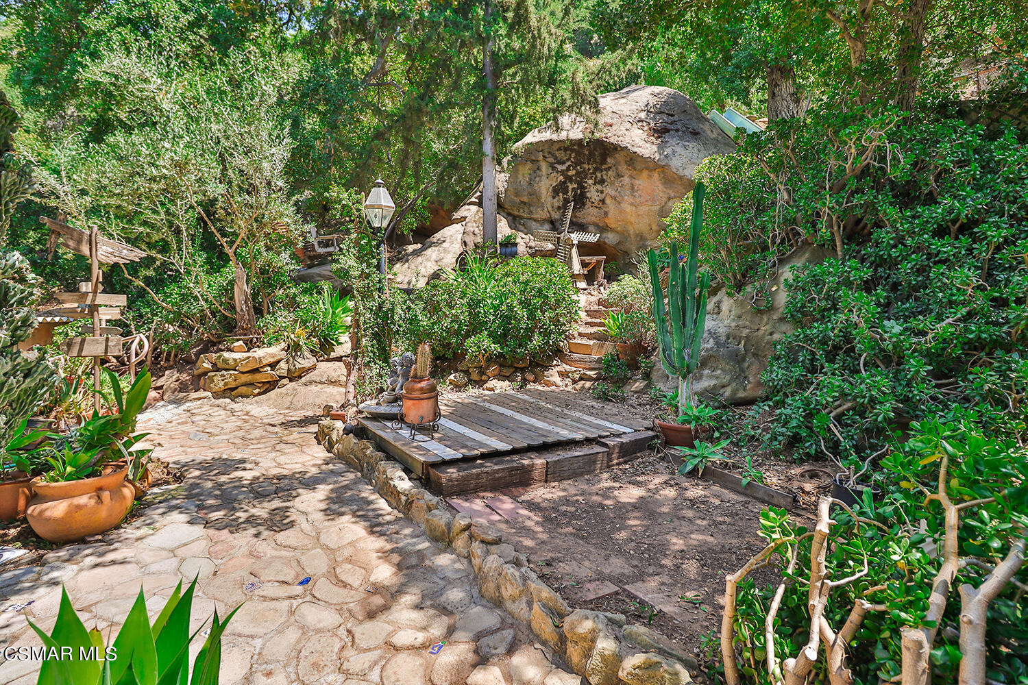 6456 Clear Springs Road Simi Valley, CA 93063 - Photo 45 of 56 a view of a backyard with plants and trees