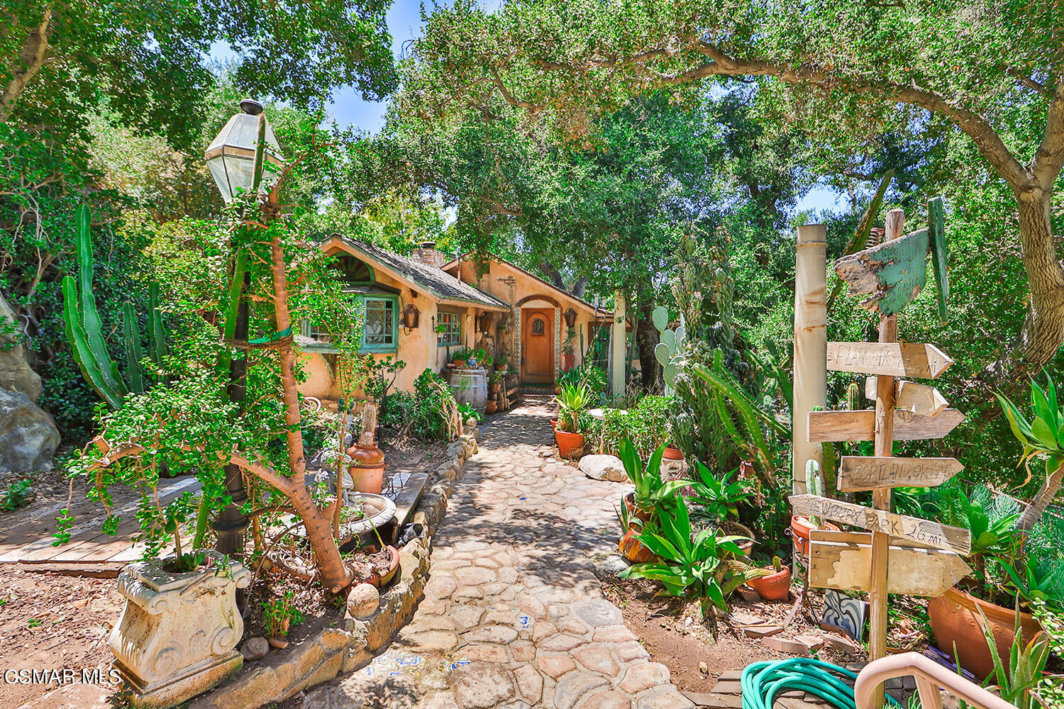 6456 Clear Springs Road Simi Valley, CA 93063 - Photo 8 of 56 a backyard of a house with lots of green space and fountain