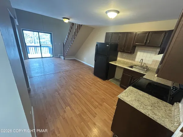 a view of kitchen with furniture and window