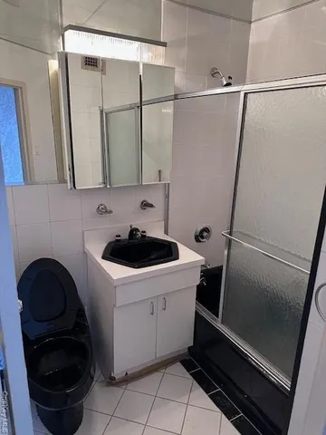 a bathroom with a sink and a washing machine