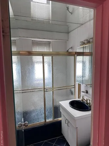 a kitchen with a sink and large window