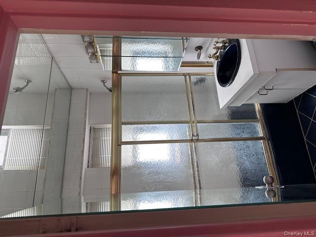 125-10 Queens Boulevard, Unit 2307 Queens, NY 11415 - Photo 14 of 25 a kitchen with a sink and large window