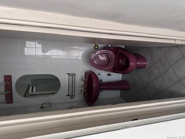 125-10 Queens Boulevard, Unit 2307 Queens, NY 11415 - Photo 21 of 25 a bathroom with a sink and a mirror