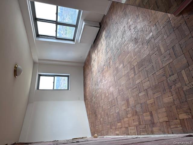 125-10 Queens Boulevard, Unit 2307 Queens, NY 11415 - Photo 9 of 25 an empty room with windows