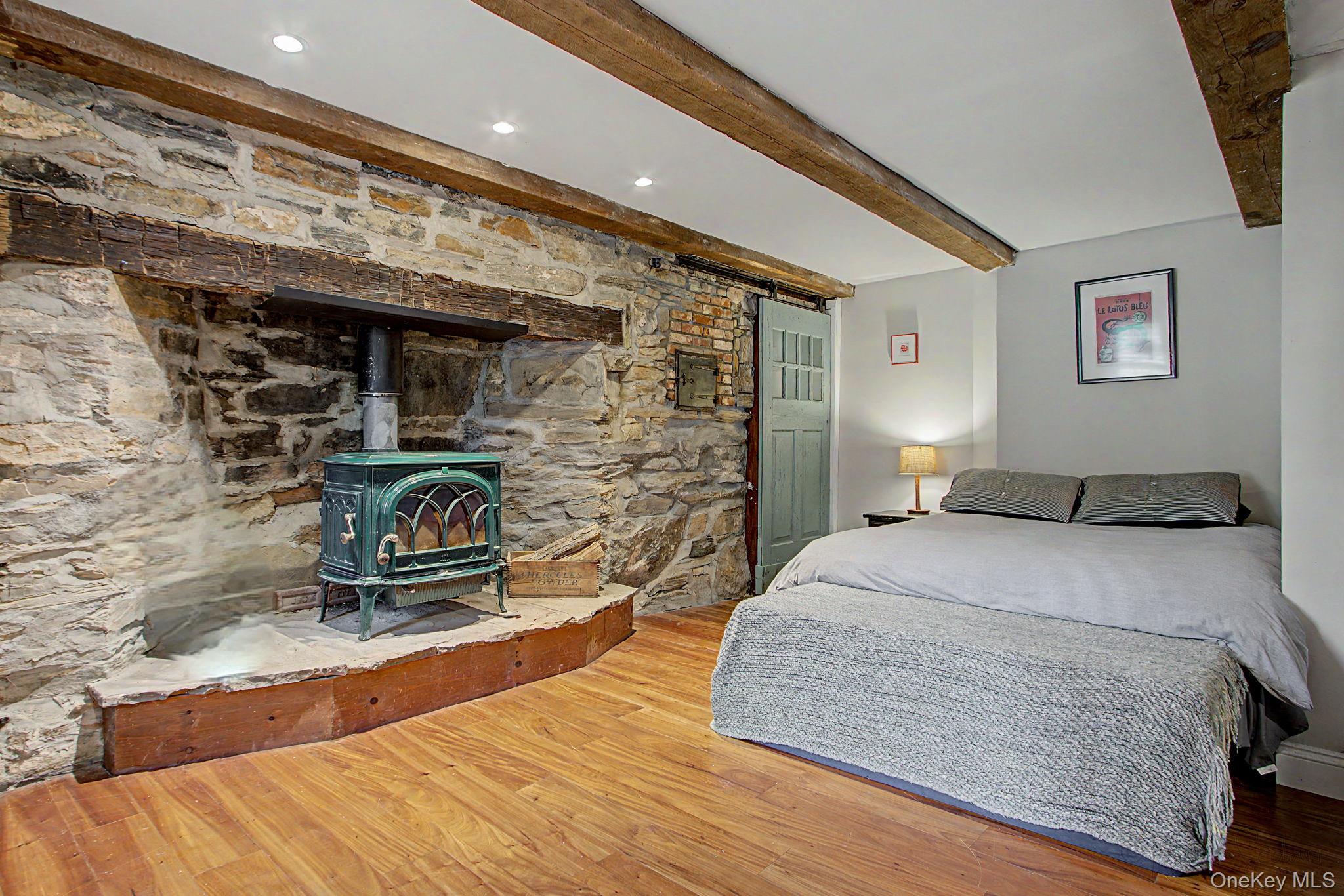 168 Old Rte 55 Pawling, NY 12564 - Photo 19 of 43 a bedroom with a bed and a fireplace