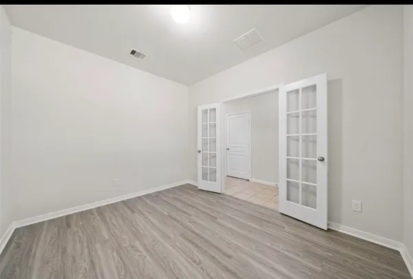 a kitchen with granite countertop a stove sink and refrigerator