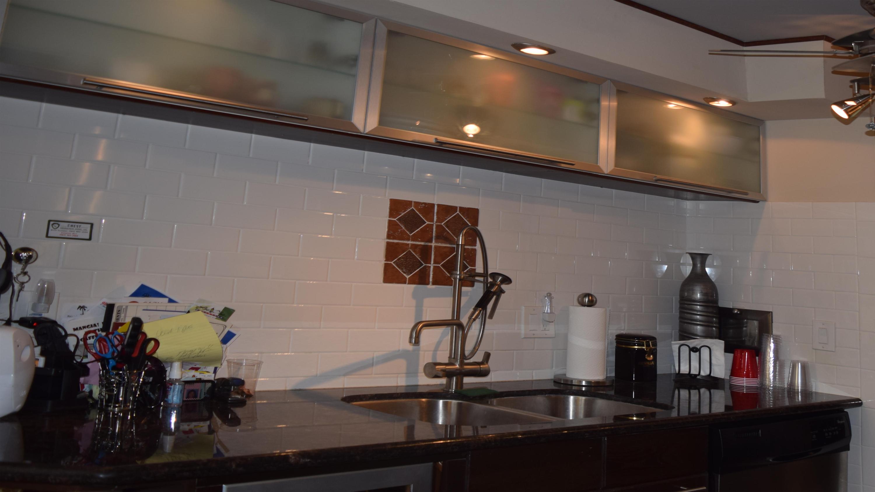 3604 Bridgewood Drive, Unit 3604 Boca Raton, FL 33434 - Photo 5 of 15 Upper kitchen cabinet