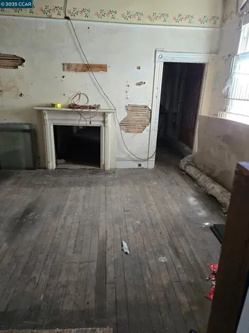 a view of a livingroom with furniture and a fireplace