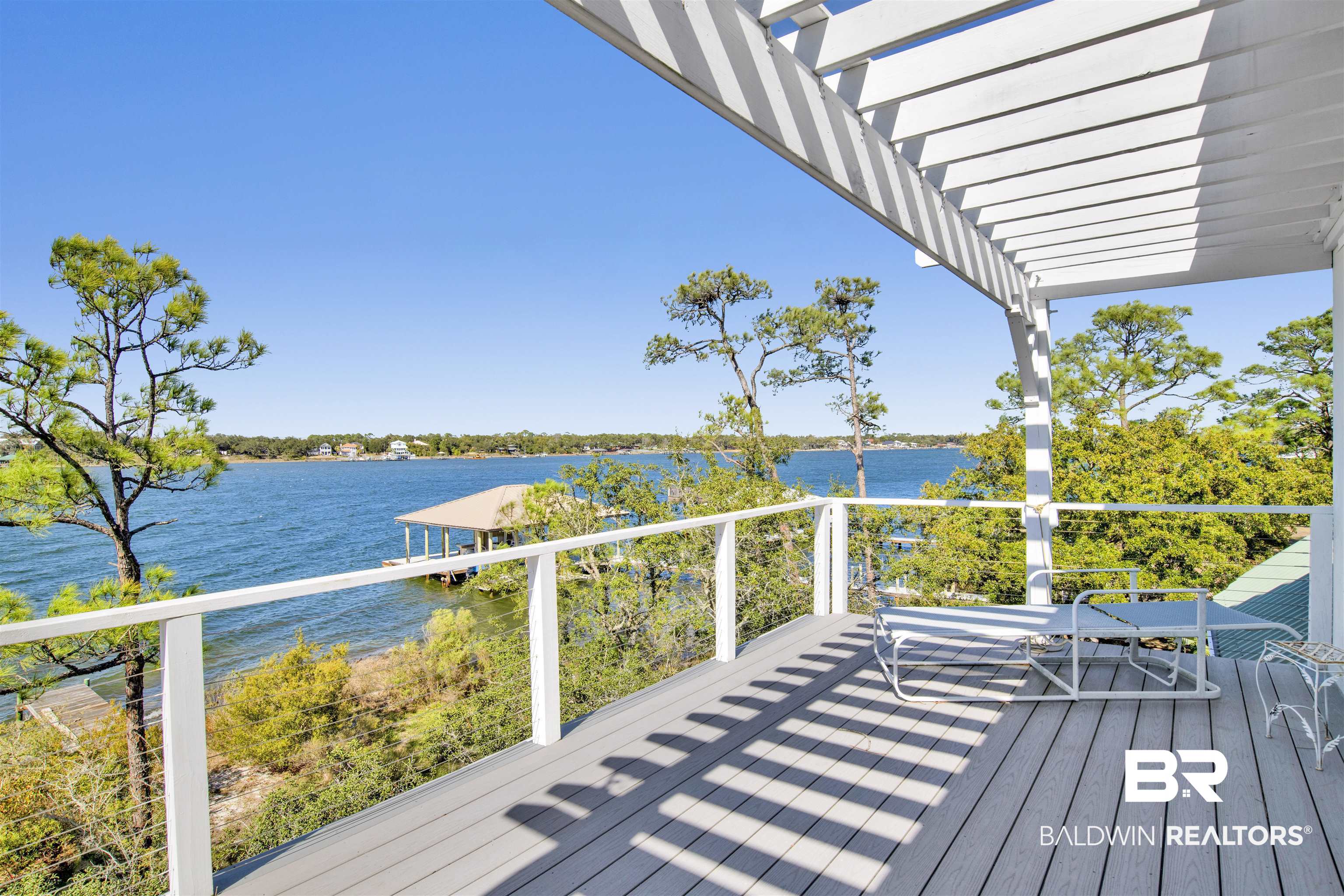 33301 River Road, Unit 25 Orange Beach, AL 36561 - Photo 27 of 44 Wooden deck with a water view and a pergola