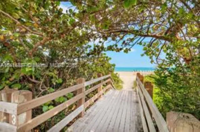 a view of a city with tall buildings and a big yard