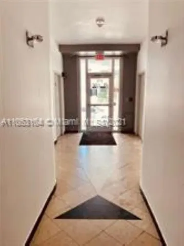 a view of a hallway with staircase