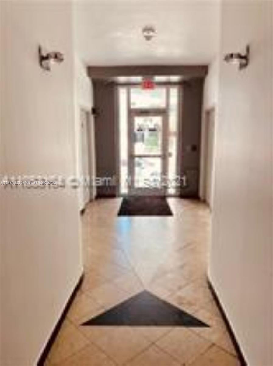 3710 Collins Avenue, Unit N103 Miami Beach, FL 33140 - Photo 39 of 53 a view of an empty room with a window