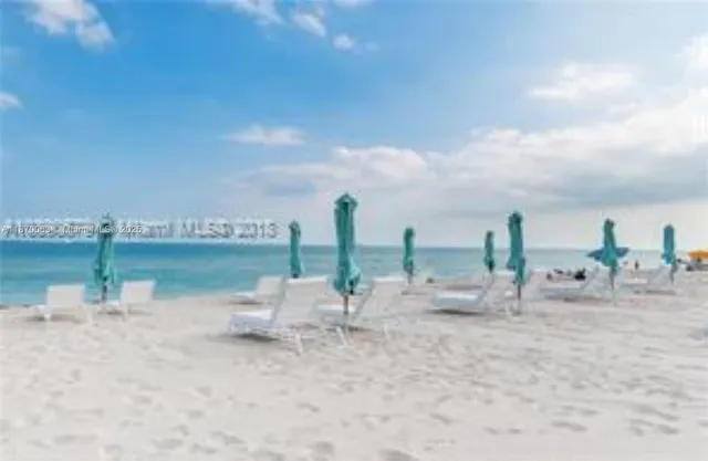 a view of a balcony with an ocean view